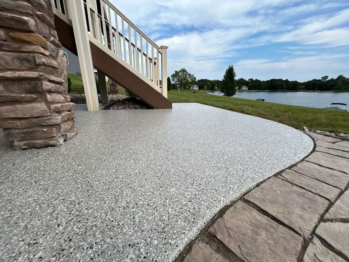 Flake-coated patio overlooking a lake