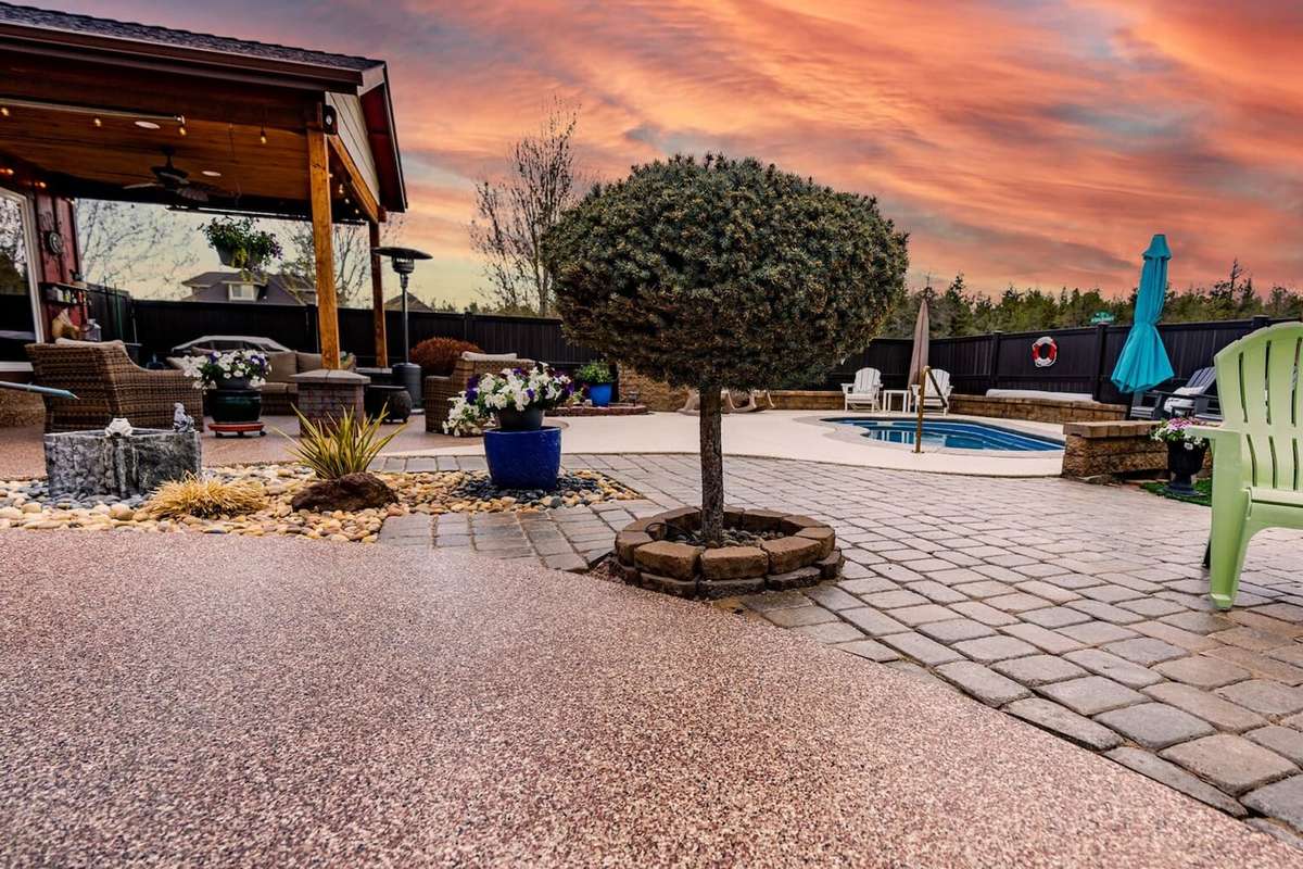 Flake-coated backyard patio at sunset