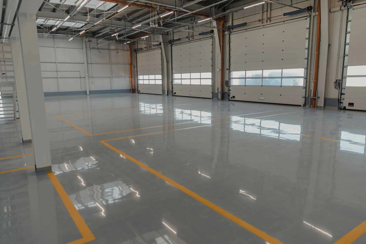 Warehouse floor coating with yellow safety striping